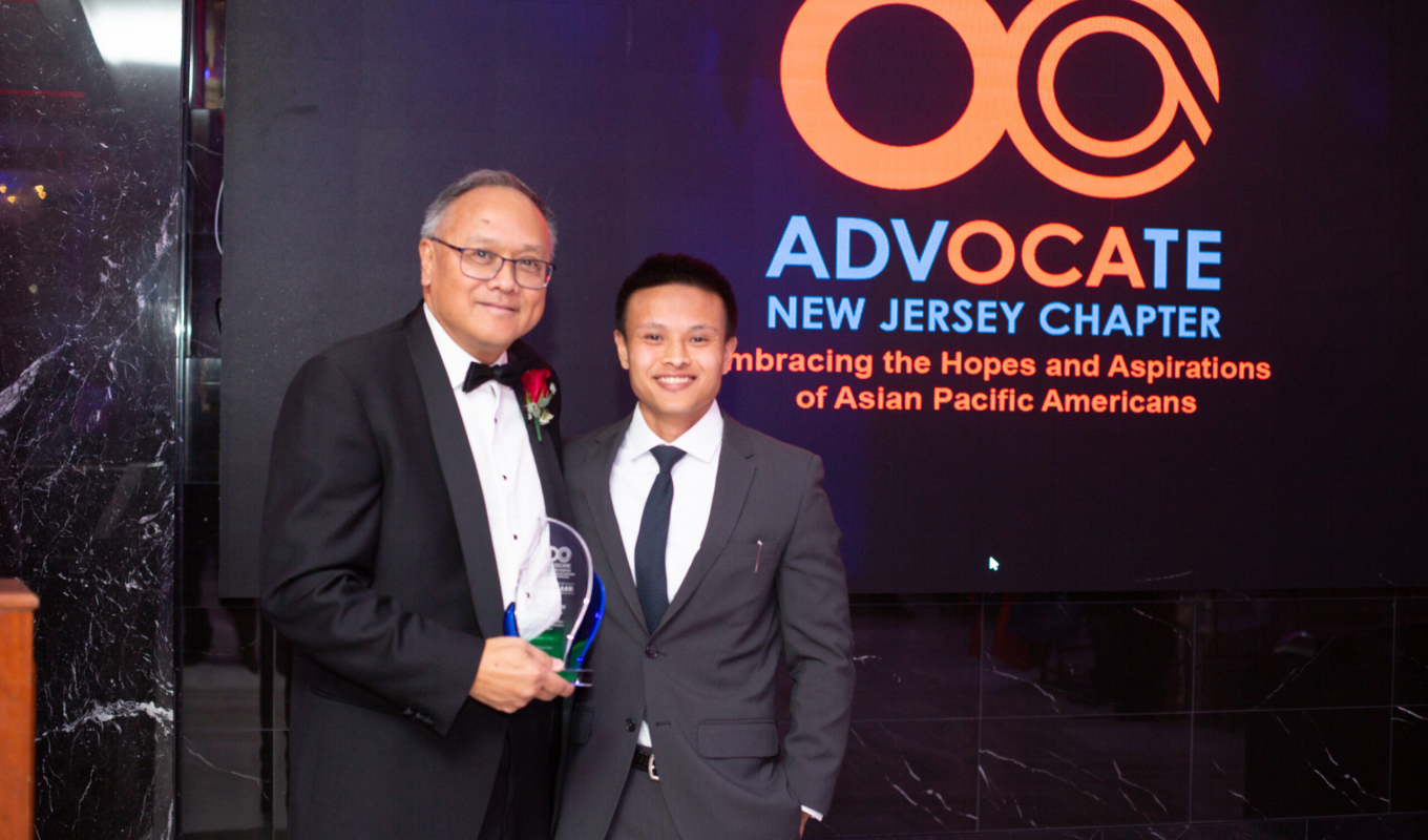 2024 HB Derek & Devin in front of OCANJ Backdrop holding Award