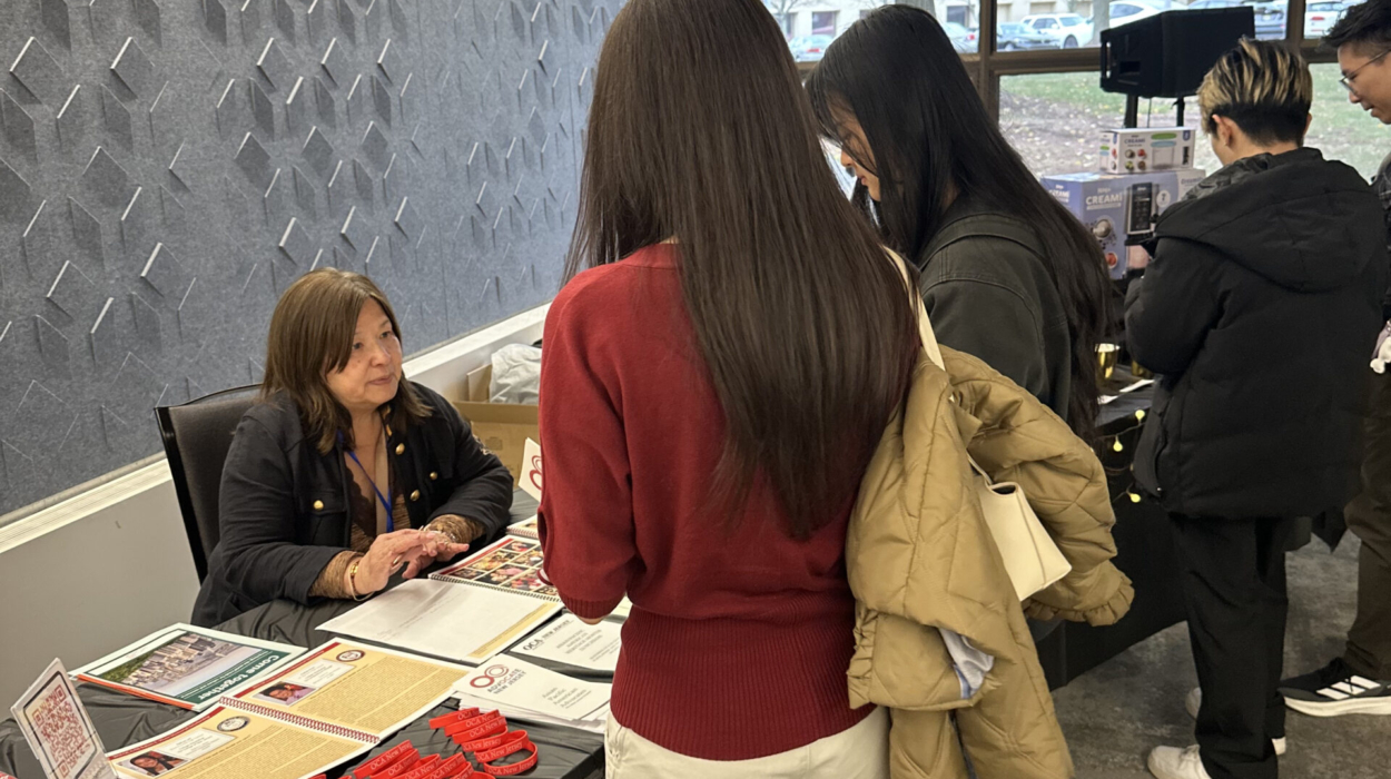 Jenny at OCA-NJ Booth talking to attendees 2 – 2025 Temple St